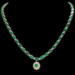 18 k solid white gold, natural emerald green and  luxury diamonds